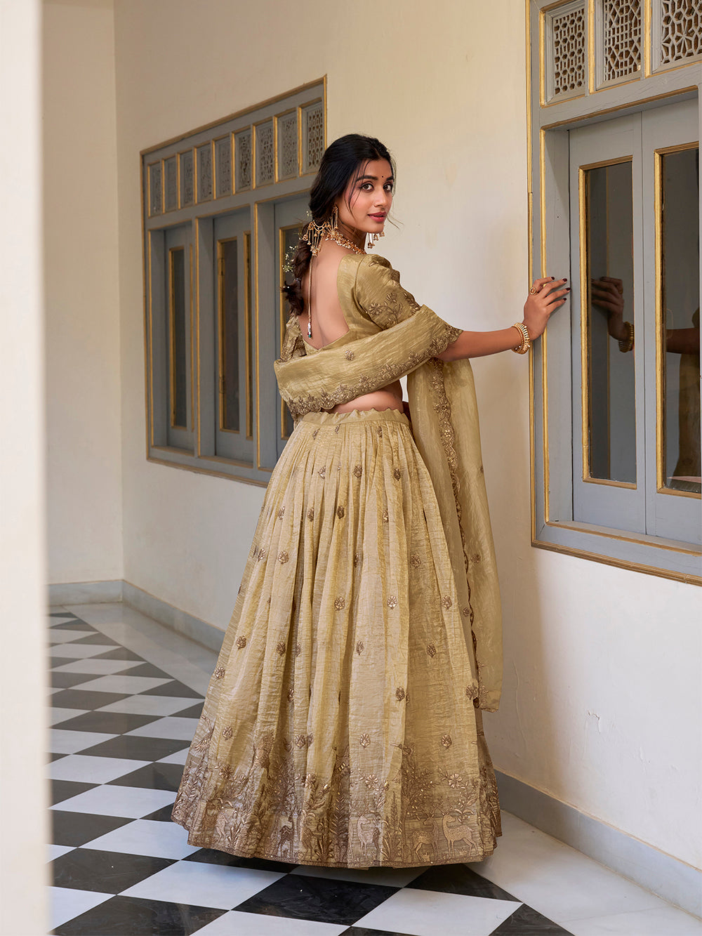 off-white-color-gold-crush-sequins-and-thread-embroidery-work-bridesmaid-lehenga-choli-by-looknbook-art.jpg
